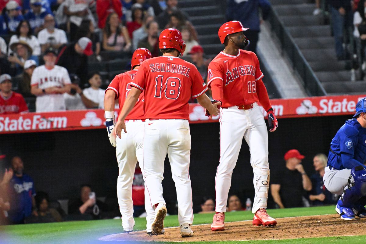 The Los Angeles Angels center fielder Mike Trout (27) first baseman Nolan Schanuel (18) and center fielder Jorge Soler (12) celebrate three runs scored during a Spring Training Game against The Los Angeles Dodgers, March 22nd, 2026 in Anaheim, California. The Los Angeles Angels center fielder Mike Trout (27) first baseman Nolan Schanuel (18) and center fielder Jorge Soler (12) celebrate three runs scored during a Spring Training Game against The Los Angeles Dodgers, March 22nd, 2026 in Anaheim, California.