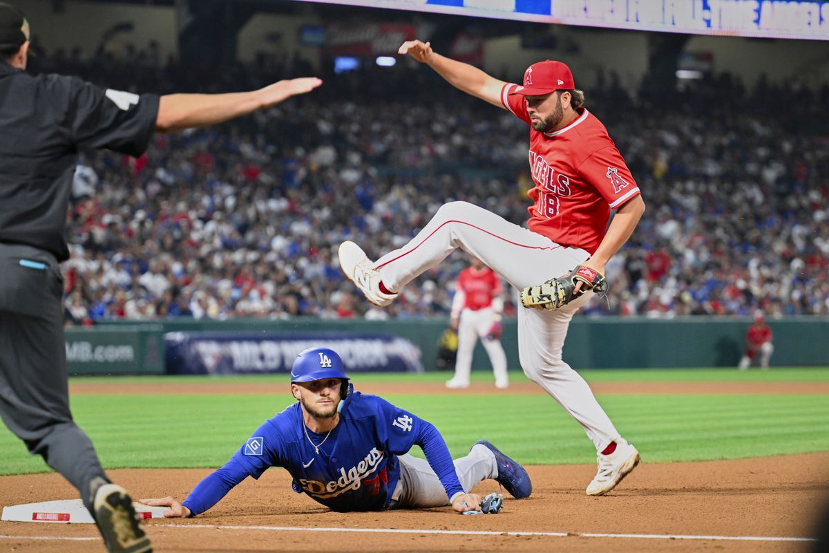 The Los Angeles Angels first baseman Nolan Schanuel (18) attempts a tag during a Spring Training Game against The Los Angeles Dodgers, March 22nd, 2026 in Anaheim, California. The Los Angeles Angels first baseman Nolan Schanuel (18) attempts a tag during a Spring Training Game against The Los Angeles Dodgers, March 22nd, 2026 in Anaheim, California.