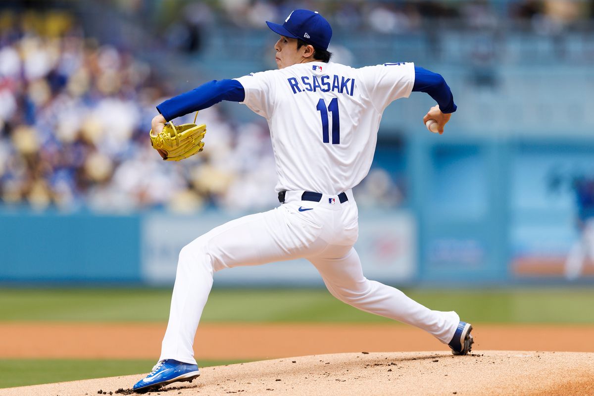 Roki Sasaki #11 of the Los Angeles Dodgers pitches during the game against the Texas Rangers at Dodger Stadium on April 12, 2026 in Los Angeles, California. Roki Sasaki #11 of the Los Angeles Dodgers pitches during the game against the Texas Rangers at Dodger Stadium on April 12, 2026 in Los Angeles, California.