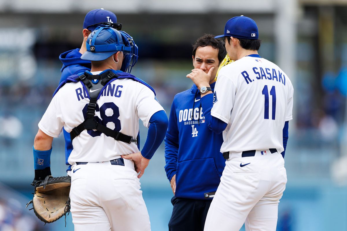 Dalton Rushing #68 of the Los Angeles Dodgers and Roki Sasaki #11 of the Los Angeles Dodgers at the mound during the game against the Texas Rangers at Dodger Stadium on April 12, 2026 in Los Angeles, California. Dalton Rushing #68 of the Los Angeles Dodgers and Roki Sasaki #11 of the Los Angeles Dodgers at the mound during the game against the Texas Rangers at Dodger Stadium on April 12, 2026 in Los Angeles, California.