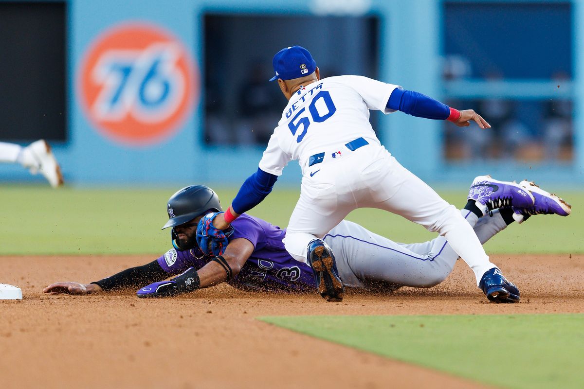 Mookie Betts #50 of the Los Angeles Dodgers tags Willi Castro #3 of the Colorado Rockies during the game at Dodger Stadium on May 25, 2026 in Los Angeles, California. Mookie Betts #50 of the Los Angeles Dodgers tags Willi Castro #3 of the Colorado Rockies during the game at Dodger Stadium on May 25, 2026 in Los Angeles, California.