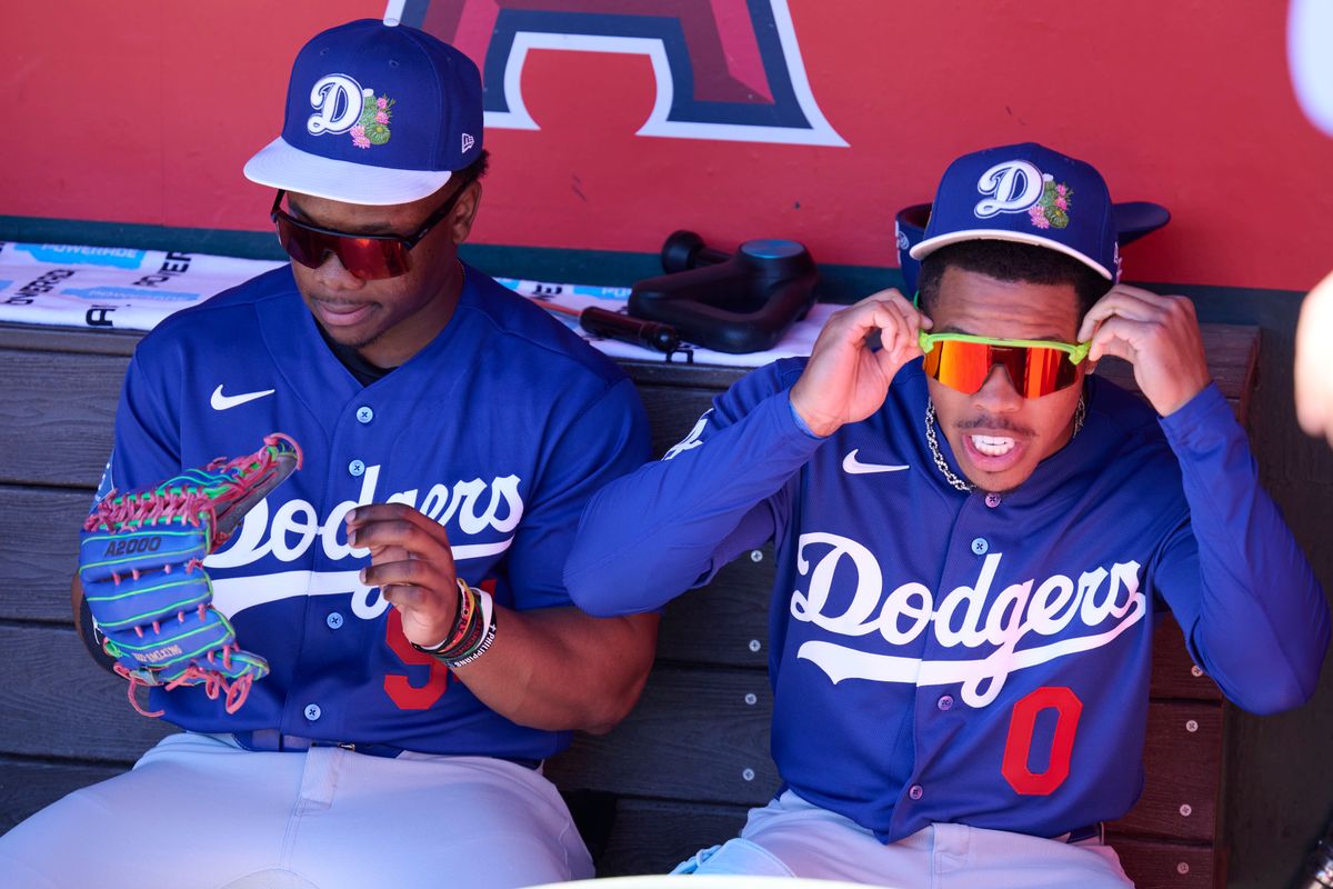 The Los Angeles Dodgers outfielder Zyhir Hope (94) and outfielder Kendall George (0) in the dugout against the Los Angeles Angels, February 21st, 2026 in Tempe Arizona.