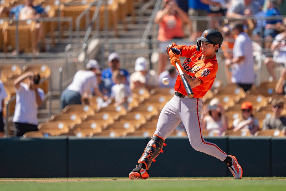 San Francisco Giants outfielder Jung Hoo Lee (51) hitting a ground ball during an MLB spring training baseball game against the Los Angeles Dodgers on March 18th, 2026 in Glendale, AZ. San Francisco Giants outfielder Jung Hoo Lee (51) hitting a ground ball during an MLB spring training baseball game against the Los Angeles Dodgers on March 18th, 2026 in Glendale, AZ.