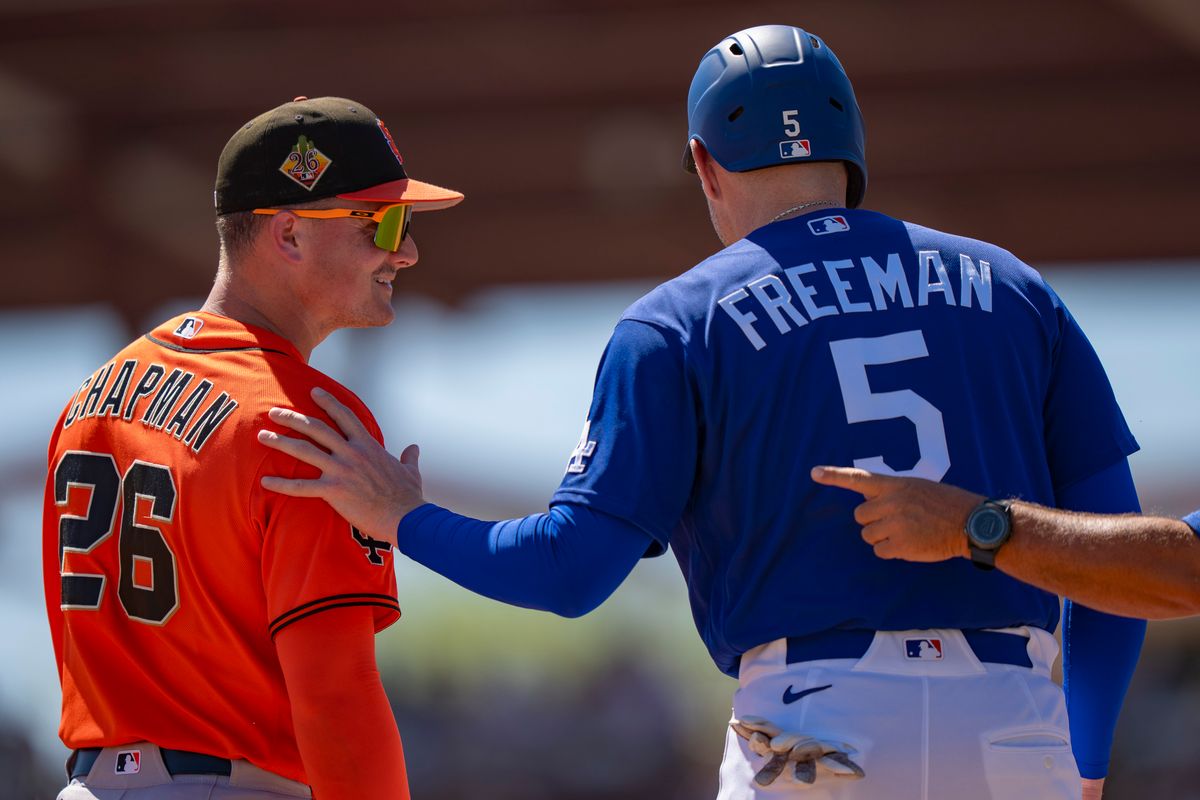 Los Angeles Dodgers first baseman Freddie Freeman (5) greeting an opponent after singling during an MLB spring training baseball game against the San Fransisco Giants on March 18th, 2026 in Glendale, AZ. Los Angeles Dodgers first baseman Freddie Freeman (5) greeting an opponent after singling during an MLB spring training baseball game against the San Fransisco Giants on March 18th, 2026 in Glendale, AZ.