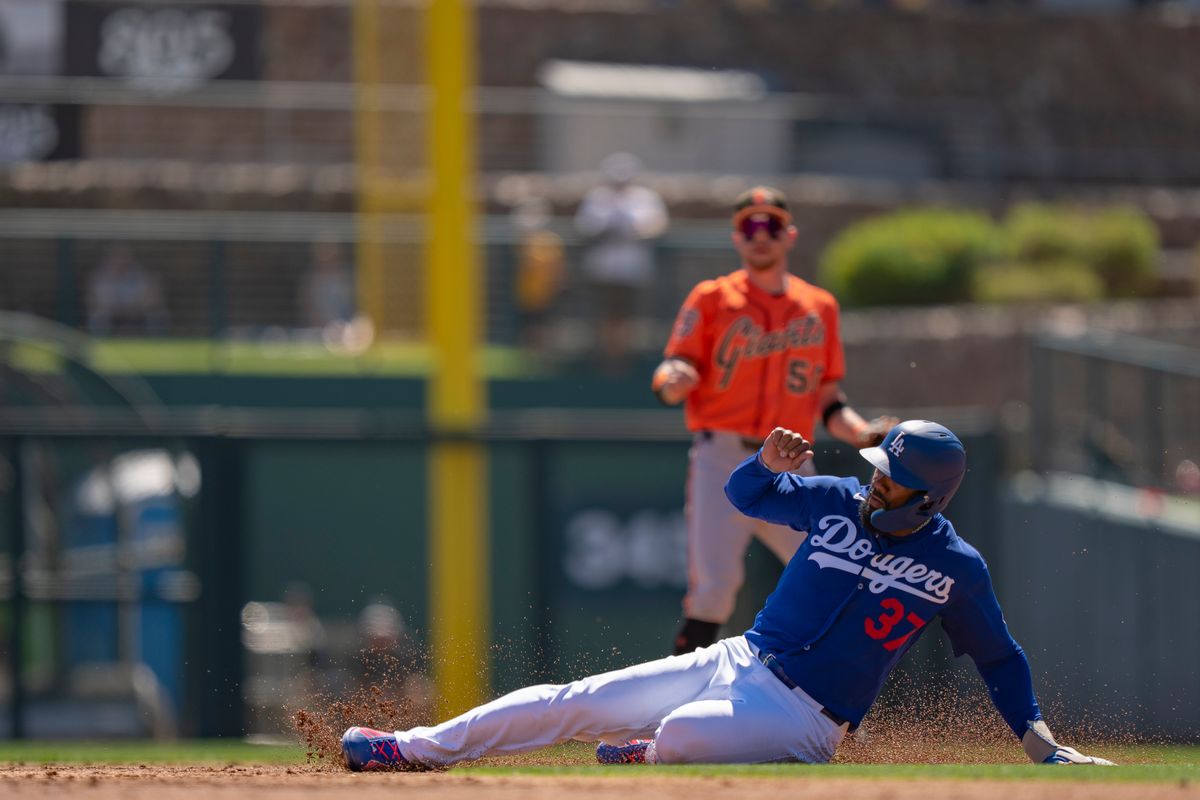 Los Angeles Dodgers outfielder Teoscar Hernandez (37) sliding into second base during an MLB spring training baseball game against the San Fransisco Giants on March 18th, 2026 in Glendale, AZ. Los Angeles Dodgers outfielder Teoscar Hernandez (37) sliding into second base during an MLB spring training baseball game against the San Fransisco Giants on March 18th, 2026 in Glendale, AZ.