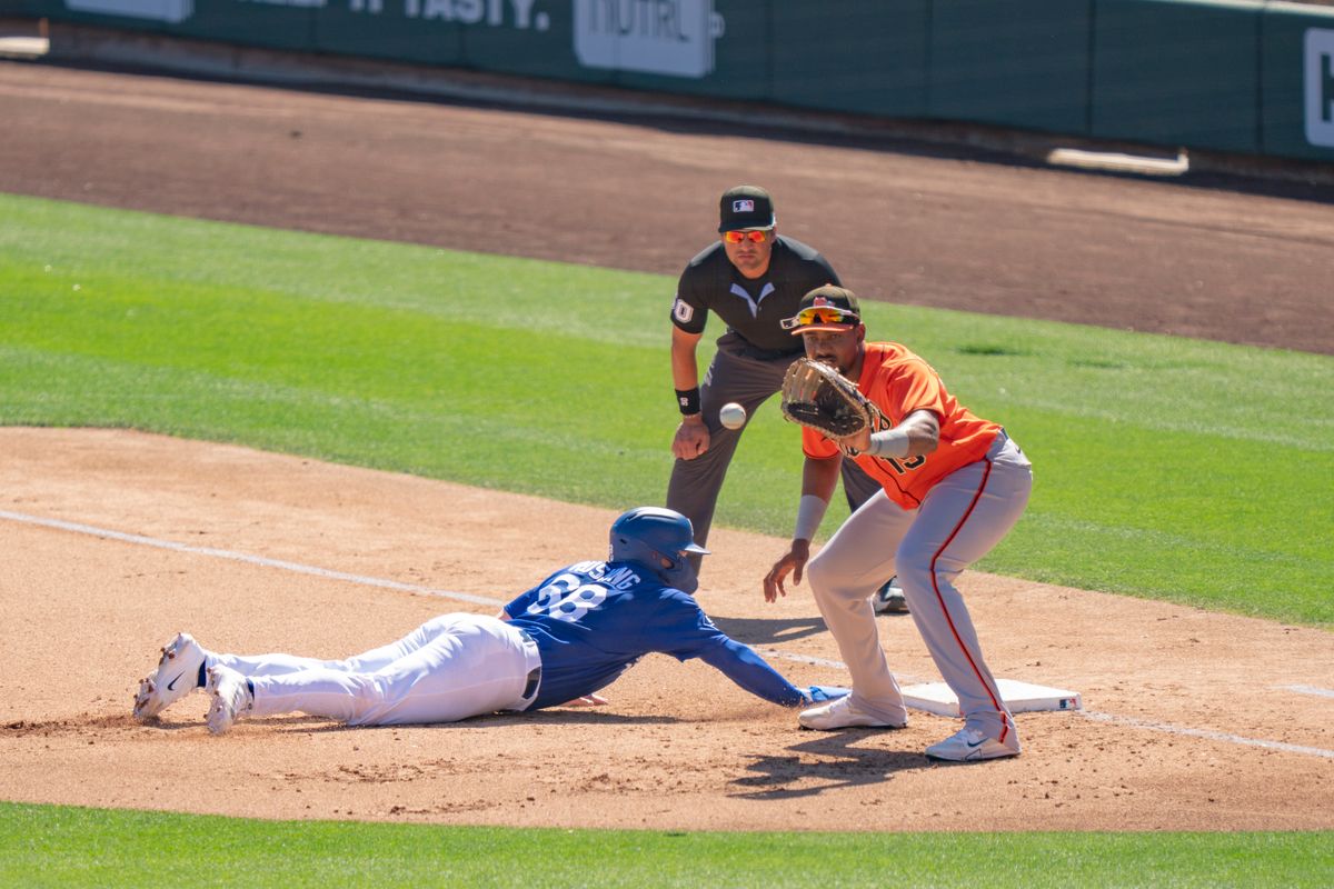Los Angeles Dodgers catcher Dalton Rushing (68) sliding back to first base, safe, during an MLB spring training baseball game against the San Fransisco Giants on March 18th, 2026 in Glendale, AZ. Los Angeles Dodgers catcher Dalton Rushing (68) sliding back to first base, safe, during an MLB spring training baseball game against the San Fransisco Giants on March 18th, 2026 in Glendale, AZ.