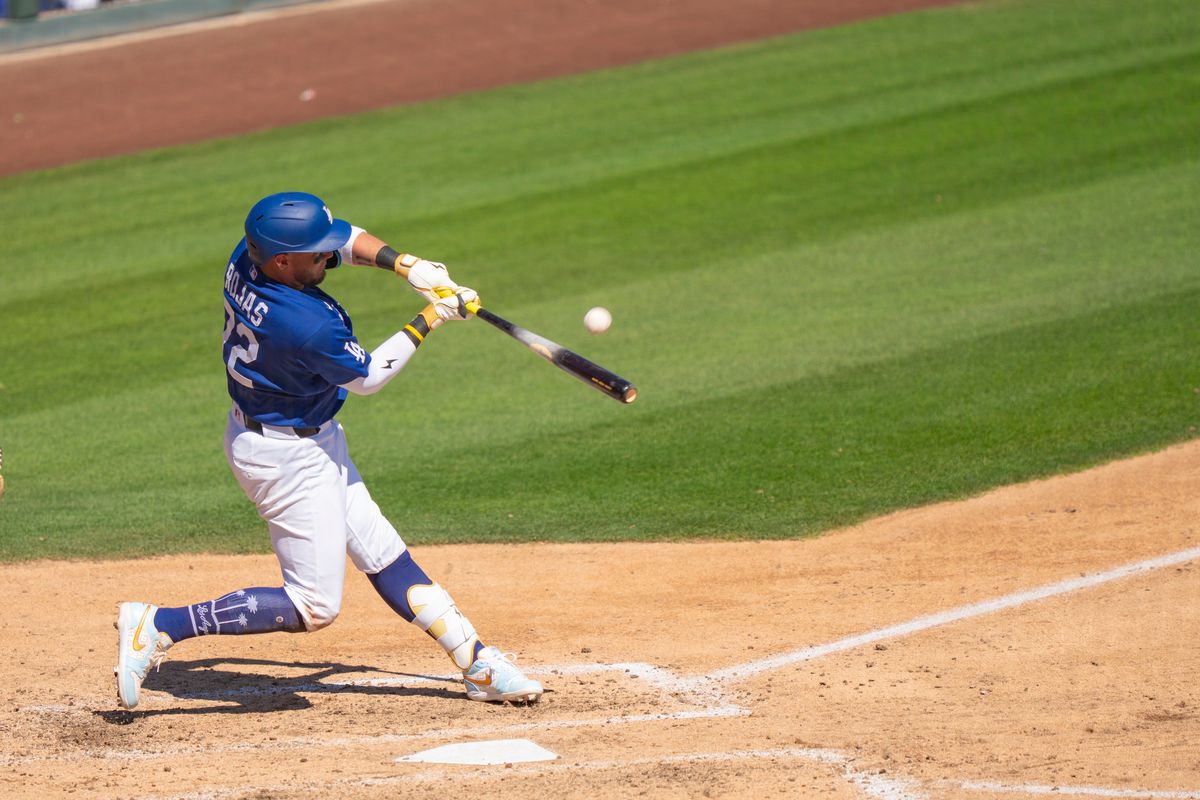 Los Angeles Dodgers outfielder Miguel Rojas (72) hitting a pop fly out during an MLB spring training baseball game against the San Fransisco Giants on March 18th, 2026 in Glendale, AZ. Los Angeles Dodgers outfielder Miguel Rojas (72) hitting a pop fly out during an MLB spring training baseball game against the San Fransisco Giants on March 18th, 2026 in Glendale, AZ.