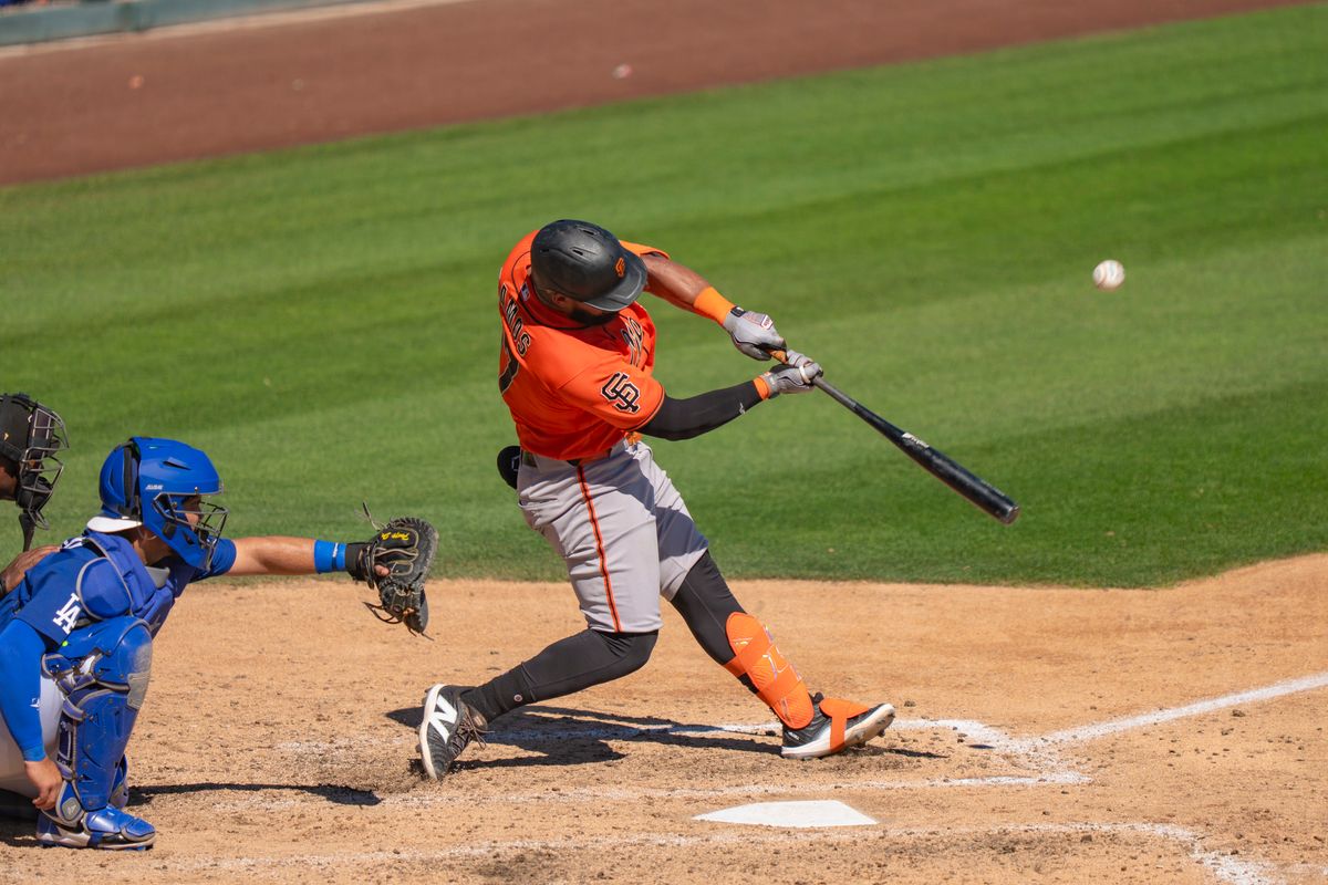 San Francisco Giants outfielder Heliot Ramos (17) hitting a pop fly during an MLB spring training baseball game against the Los Angeles Dodgers on March 18th, 2026 in Glendale, AZ. San Francisco Giants outfielder Heliot Ramos (17) hitting a pop fly during an MLB spring training baseball game against the Los Angeles Dodgers on March 18th, 2026 in Glendale, AZ.