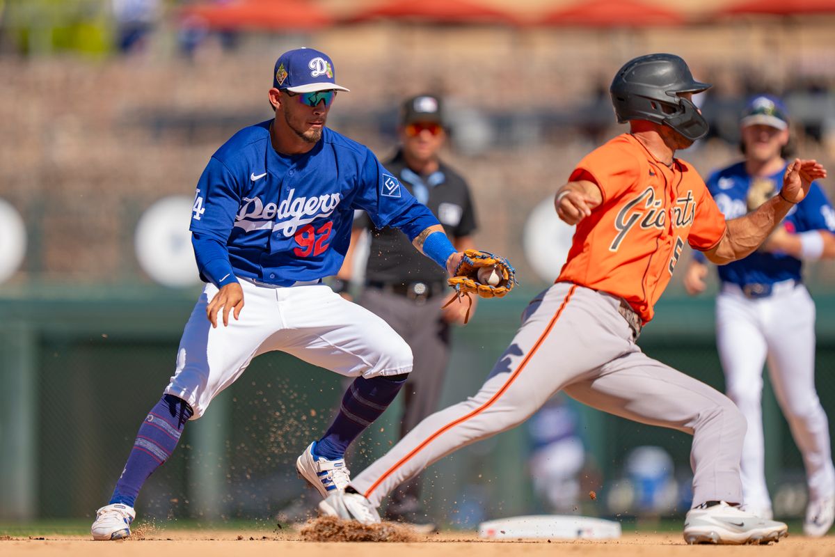 Los Angeles Dodgers second baseman Nico Perez (92) tagging a runner out during an MLB spring training baseball game against the San Fransisco Giants on March 18th, 2026 in Glendale, AZ. Los Angeles Dodgers second baseman Nico Perez (92) tagging a runner out during an MLB spring training baseball game against the San Fransisco Giants on March 18th, 2026 in Glendale, AZ.