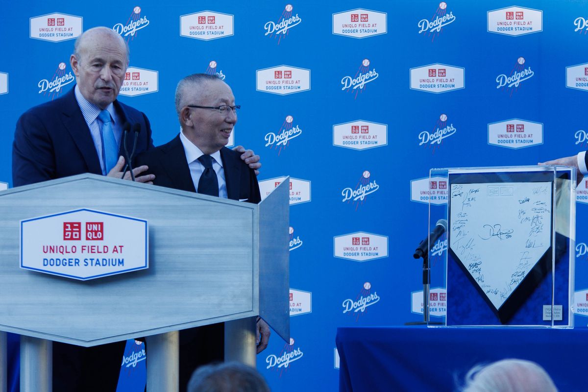 UNIQLO founder Tadashi Janai is gifted a home plate signed by the Los Angeles Dodgers' players during a UNIQLO partnership press conference on March 25, 2026 in Los Angeles, California. UNIQLO founder Tadashi Janai is gifted a home plate signed by the Los Angeles Dodgers' players during a UNIQLO partnership press conference on March 25, 2026 in Los Angeles, California.