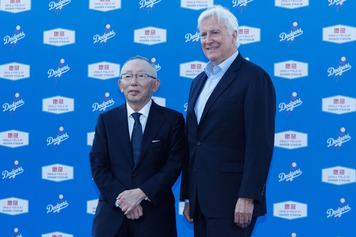 UNQILO founder Tadashi Yanai and Los Angeles Dodgers chairman Mark Walter take a picture together during a UNIQLO partnership press conference on March 25, 2026 in Los Angeles, California. UNQILO founder Tadashi Yanai and Los Angeles Dodgers chairman Mark Walter take a picture together during a UNIQLO partnership press conference on March 25, 2026 in Los Angeles, California.