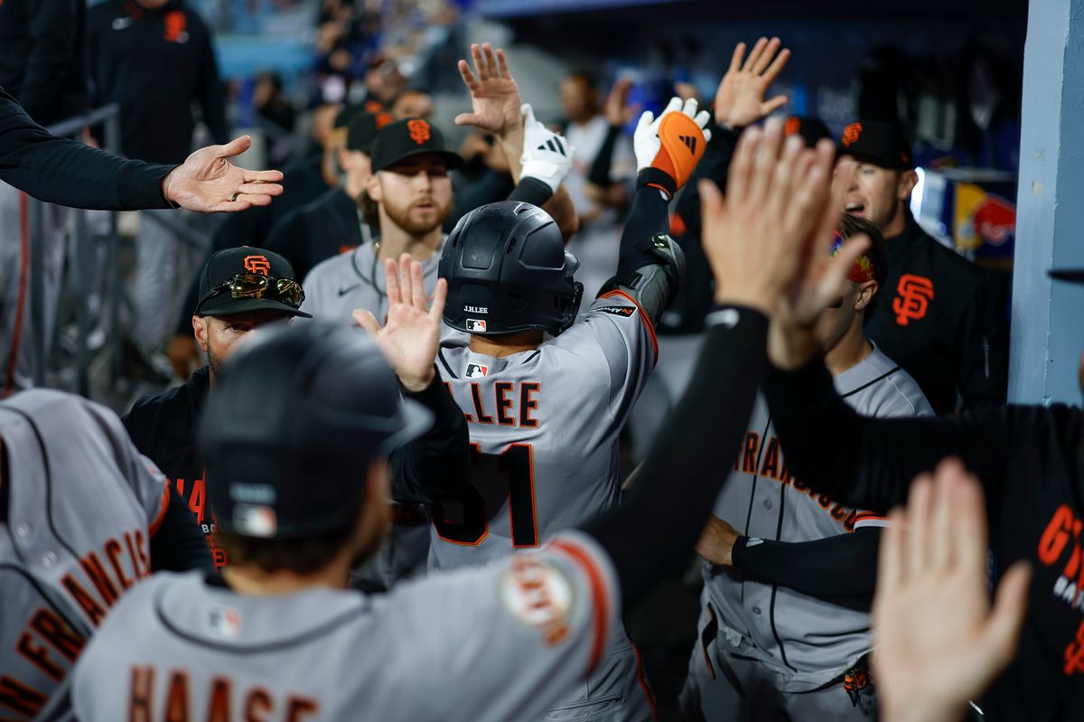 Jung Hoo Lee #51 of the San Francisco Giants celebrates an inside the park home run against the Los Angeles Dodgers at Dodger Stadium on May 14, 2026 in Los Angeles, CA. Jung Hoo Lee #51 of the San Francisco Giants celebrates an inside the park home run against the Los Angeles Dodgers at Dodger Stadium on May 14, 2026 in Los Angeles, CA.