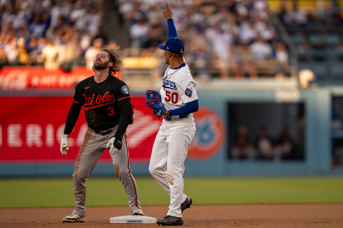 Los Angeles Dodgers infielder Mookie Betts (50) celebrating an out at second base during an MLB baseball game against the Baltimore Orioles on June 19th, 2026 in Los Angeles, CA. Los Angeles Dodgers infielder Mookie Betts (50) celebrating an out at second base during an MLB baseball game against the Baltimore Orioles on June 19th, 2026 in Los Angeles, CA.