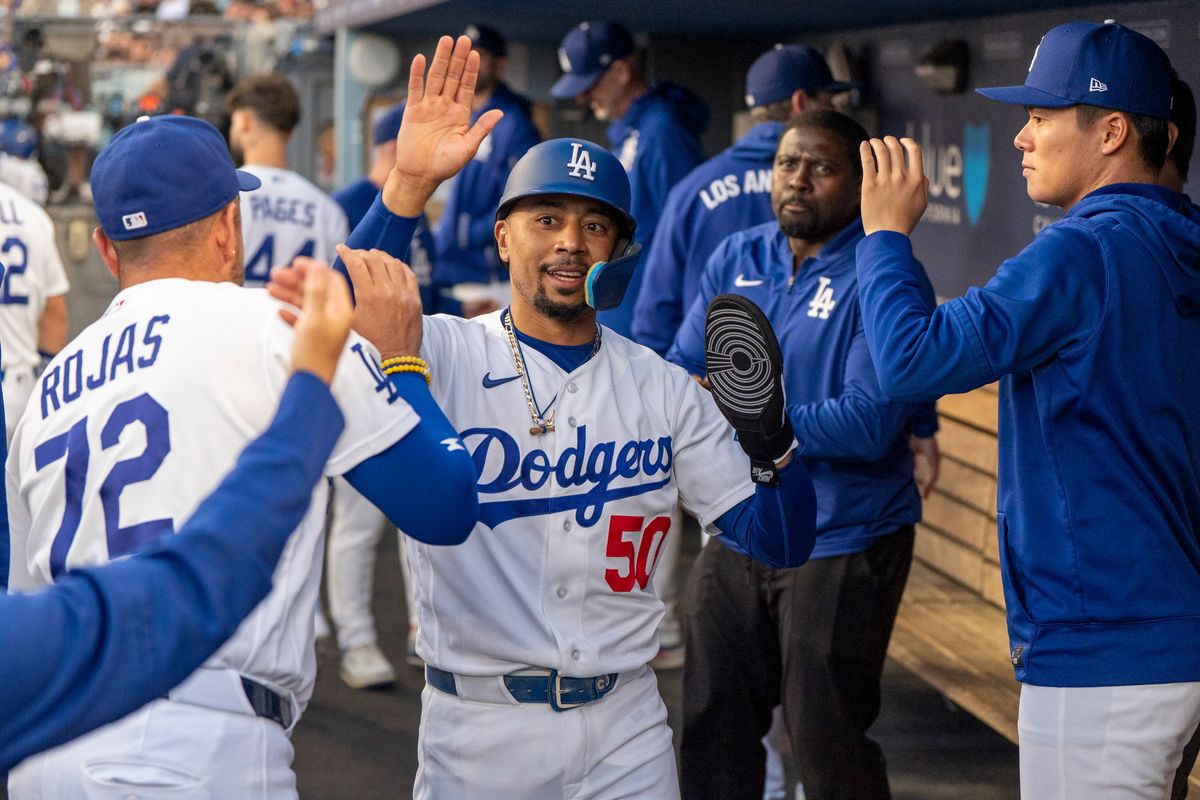 Los Angeles Dodgers infielder Mookie Betts (50) celebrates a run in the dugout during an MLB baseball game against the Baltimore Orioles on June 19th, 2026 in Los Angeles, CA. Los Angeles Dodgers infielder Mookie Betts (50) celebrates a run in the dugout during an MLB baseball game against the Baltimore Orioles on June 19th, 2026 in Los Angeles, CA.