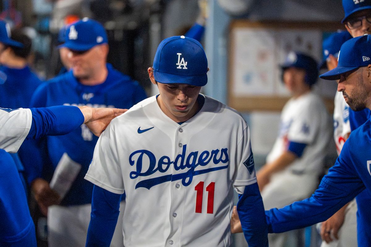 Los Angeles Dodgers pitcher Roki Sasaki (11) returns to the dugout sullenly after being relieved during an MLB baseball game against the Baltimore Orioles on June 19th, 2026 in Los Angeles, CA. Los Angeles Dodgers pitcher Roki Sasaki (11) returns to the dugout sullenly after being relieved during an MLB baseball game against the Baltimore Orioles on June 19th, 2026 in Los Angeles, CA.