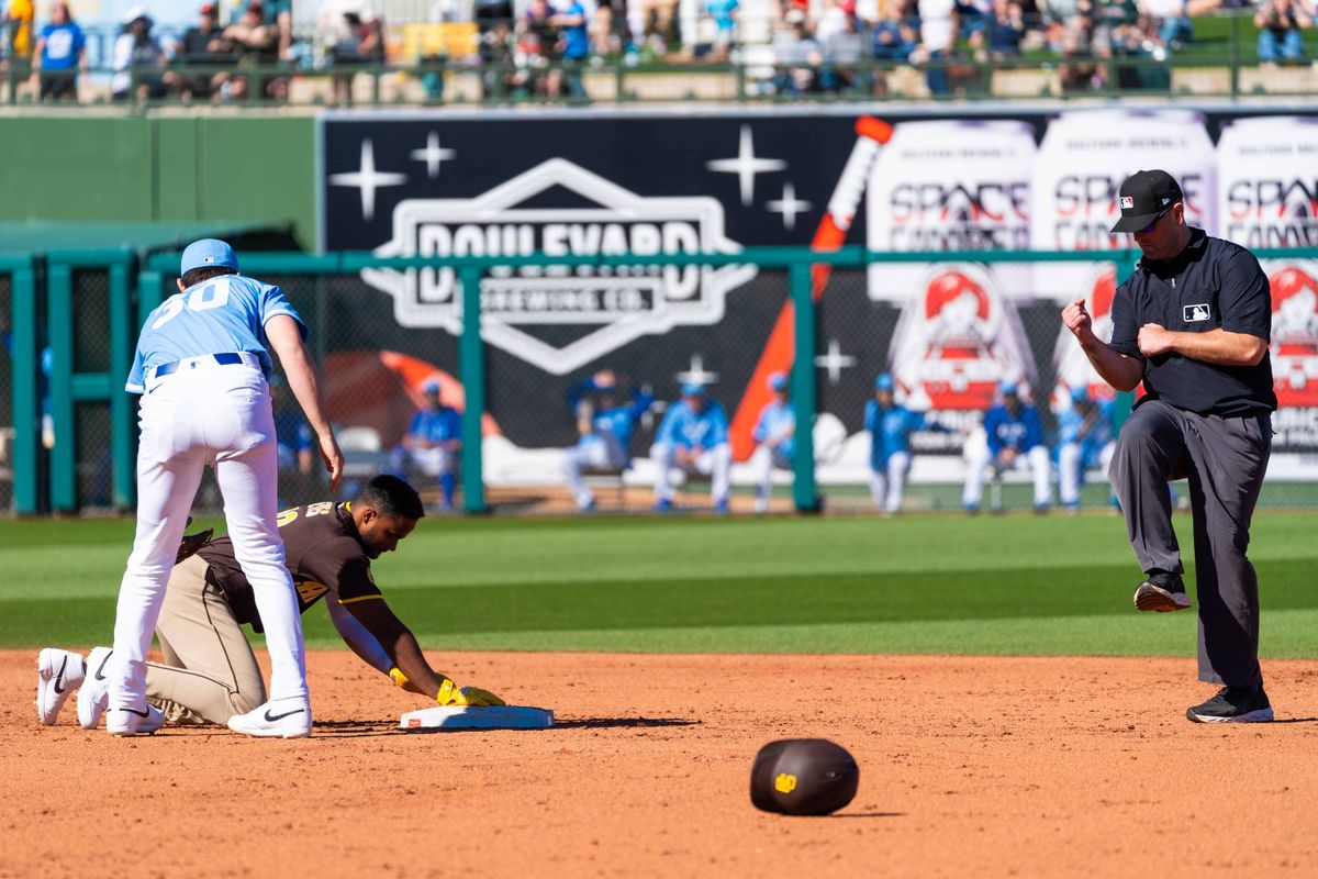 San Diego Padres outfielder Pablo Reyes (26) is thrown out during an MLB Spring Training game between the San Diego Padres and the Kansas City Royals, Saturday February 21, 2026 at Surprise Stadium in Surprise, AZ. San Diego Padres outfielder Pablo Reyes (26) is thrown out during an MLB Spring Training game between the San Diego Padres and the Kansas City Royals, Saturday February 21, 2026 at Surprise Stadium in Surprise, AZ.