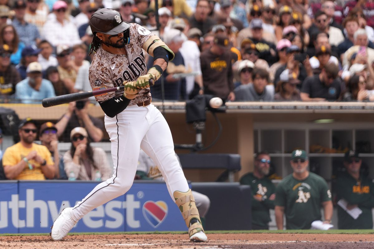 Padres right fielder Fernando Tatis Jr. (23) hits the ball during an MLB baseball game against the Athletics, Sunday May 24, 2026 in San Diego, California. Padres right fielder Fernando Tatis Jr. (23) hits the ball during an MLB baseball game against the Athletics, Sunday May 24, 2026 in San Diego, California.