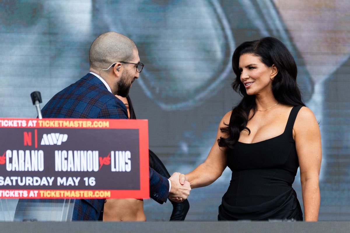 MMA fighter and actress Gina Carano shakes hands with Journalist Ariel Helwani during a pre-fight press conference for a Netflix fight, Tuesday March 10, 2026 in Inglewood, Calif. MMA fighter and actress Gina Carano shakes hands with Journalist Ariel Helwani during a pre-fight press conference for a Netflix fight, Tuesday March 10, 2026 in Inglewood, Calif.