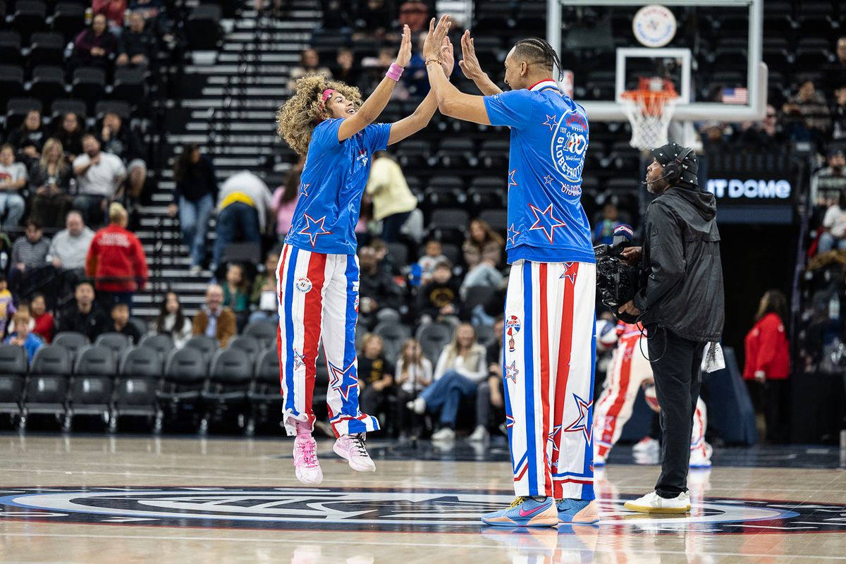 Harlem Globetrotters guard Sunshine West (8) celebrates during a Harlem Globetrotter basketball game against The Washington Generals, Friday February 20, 2026 in Los Angeles.