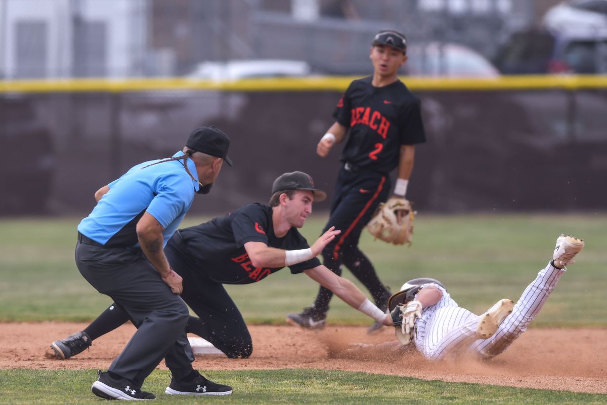 Huntington Beach Jason Dunham (56) tags out the baserunner during an High School Baseball game against Temecula Valley Tuesday May 12, 2026 in Temecula, California. Huntington Beach Jason Dunham (56) tags out the baserunner during an High School Baseball game against Temecula Valley Tuesday May 12, 2026 in Temecula, California.