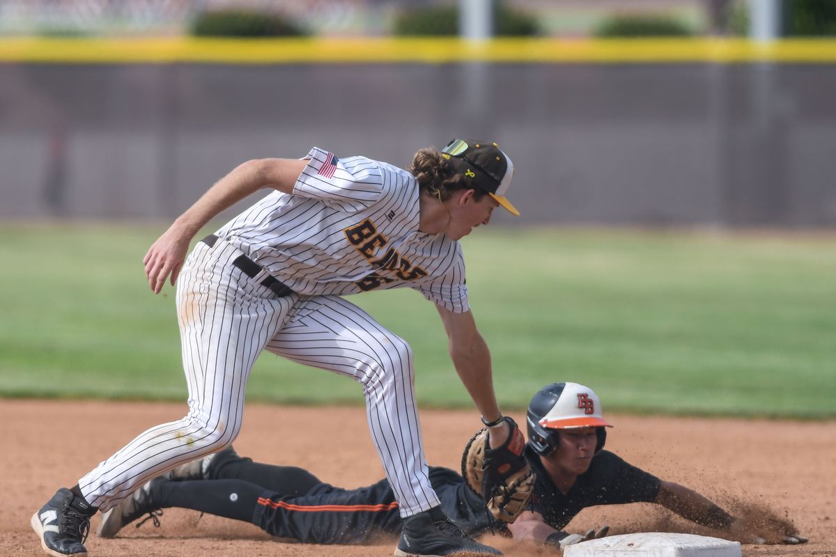 Huntington Beach Sol Moriyama (2) slides back to first ahead of the throw to Temecula Valley Chase Hilt (26) during an High School Baseball game against Temecula Valley Tuesday May 12, 2026 in Temecula, California. Huntington Beach Sol Moriyama (2) slides back to first ahead of the throw to Temecula Valley Chase Hilt (26) during an High School Baseball game against Temecula Valley Tuesday May 12, 2026 in Temecula, California.