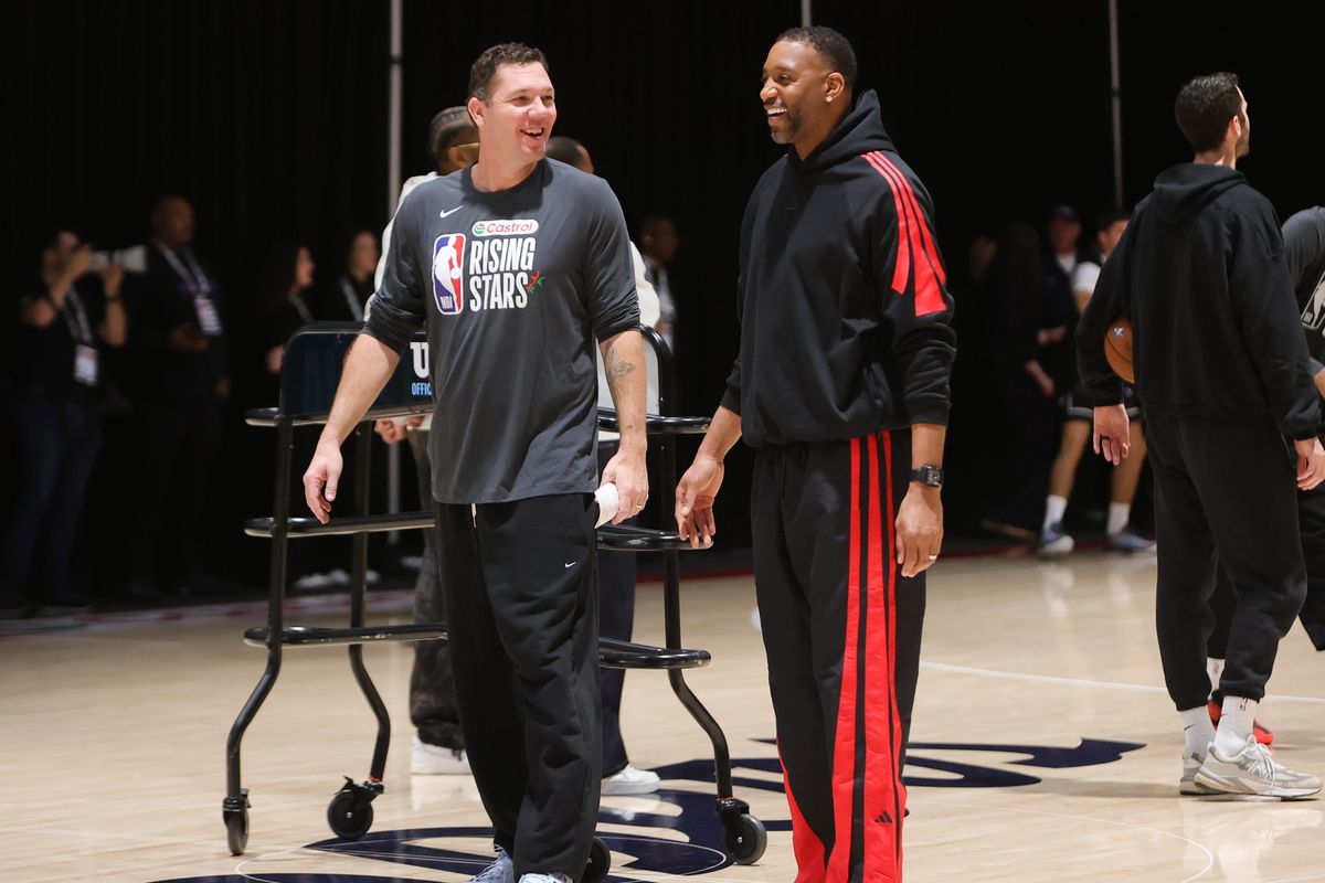 Former Laker Luke Walton and NBA Hall of Famer Tracy McGrady share a laugh during NBA Rising Stars practice on February 13, 2026 in Inglewood, CA.