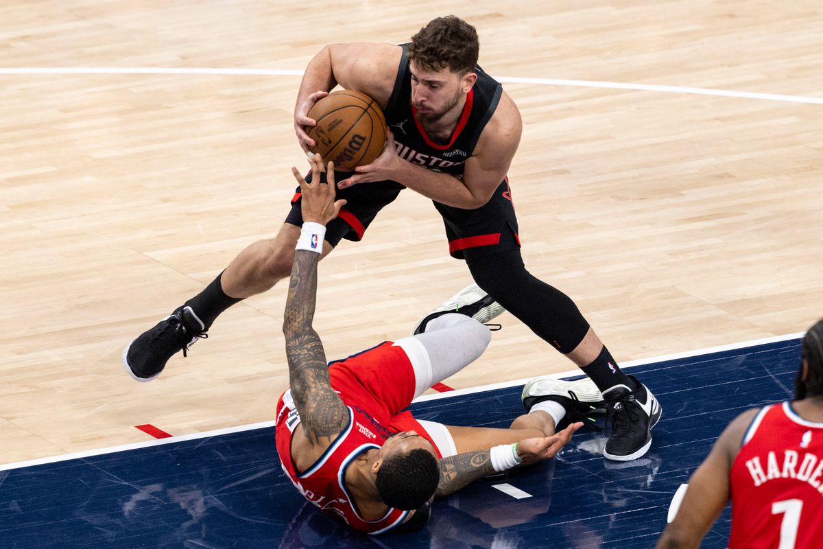 Alperen Sengun #28 of the Houston Rockets steps over John Collins #20 of the LA Clippers during an NBA basketball game, Tuesday December 23, 2025 in Inglewood, Calif. Alperen Sengun #28 of the Houston Rockets steps over John Collins #20 of the LA Clippers during an NBA basketball game, Tuesday December 23, 2025 in Inglewood, Calif.
