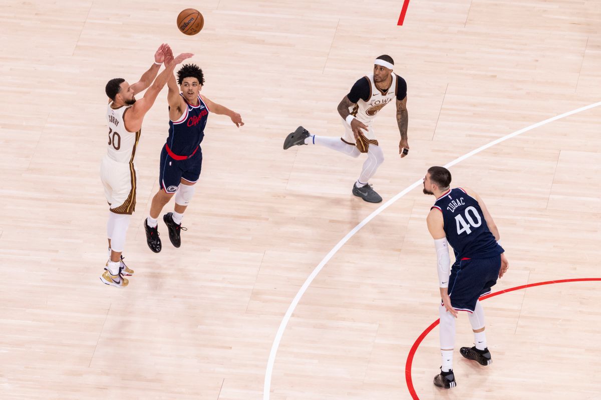 Stephen Curry #30 of the Golden State Warriors shoots a long three pointer over Kobe Sanders #4 of the LA Clippers during an NBA basketball game, Monday January 5, 2026 in Inglewood, Calif. Stephen Curry #30 of the Golden State Warriors shoots a long three pointer over Kobe Sanders #4 of the LA Clippers during an NBA basketball game, Monday January 5, 2026 in Inglewood, Calif.