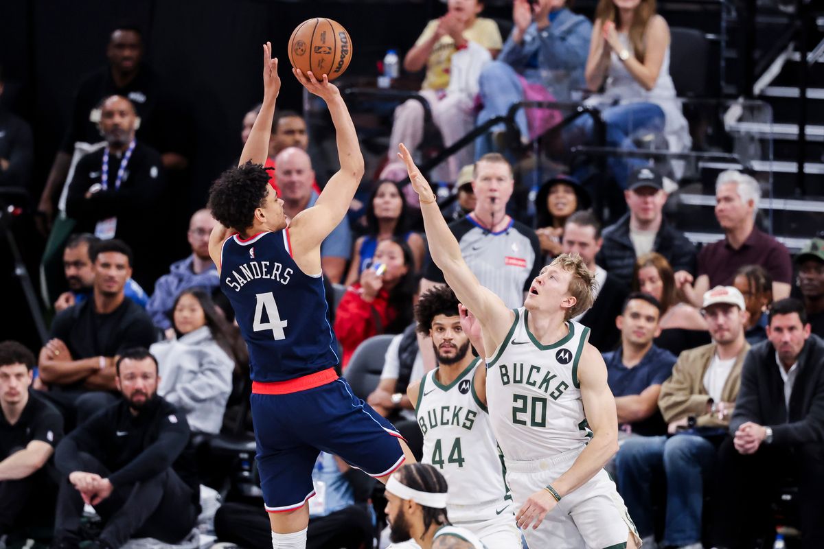 Kobe Sanders #4 of the LA Clippers shoots the ball over AJ Green #20 of the Milwaukee Bucks during an NBA basketball game, 2026 in Inglewood, Calif. Kobe Sanders #4 of the LA Clippers shoots the ball over AJ Green #20 of the Milwaukee Bucks during an NBA basketball game, 2026 in Inglewood, Calif.
