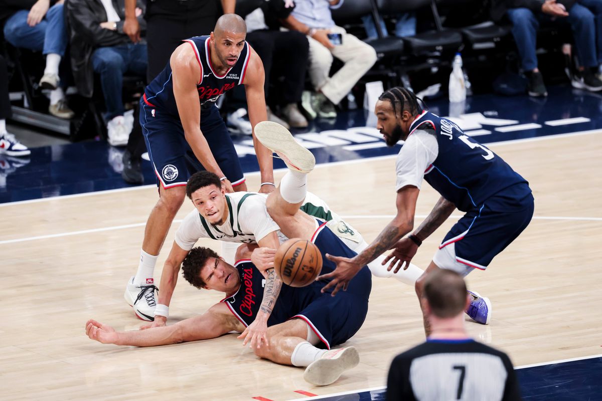Brook Lopez #11 of the LA Clippers and Ryan Rollins #13 of the Milwaukee Bucks fight for a loose ball on the floor during an NBA basketball game, 2026 in Inglewood, Calif. Brook Lopez #11 of the LA Clippers and Ryan Rollins #13 of the Milwaukee Bucks fight for a loose ball on the floor during an NBA basketball game, 2026 in Inglewood, Calif.