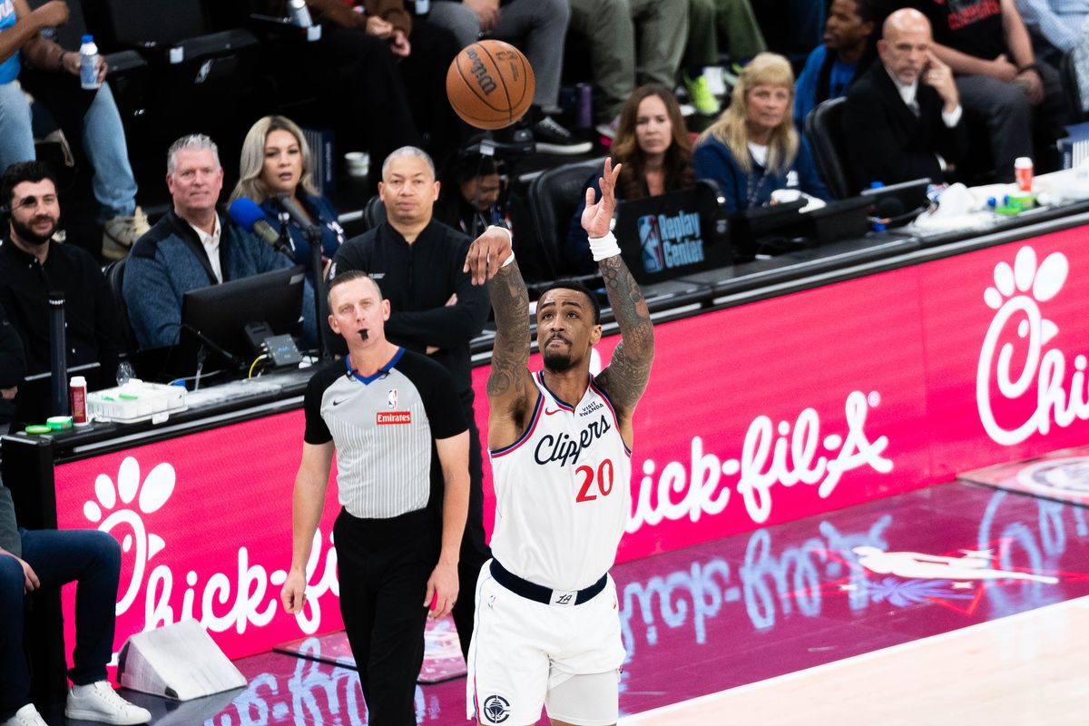 Los Angeles Clippers forward John Collins (20) shoots a three-pointer during an NBA basketball game against the Golden State Warriors,Sunday April 12th, 2026 in Inglewood, California. Los Angeles Clippers forward John Collins (20) shoots a three-pointer during an NBA basketball game against the Golden State Warriors,Sunday April 12th, 2026 in Inglewood, California.