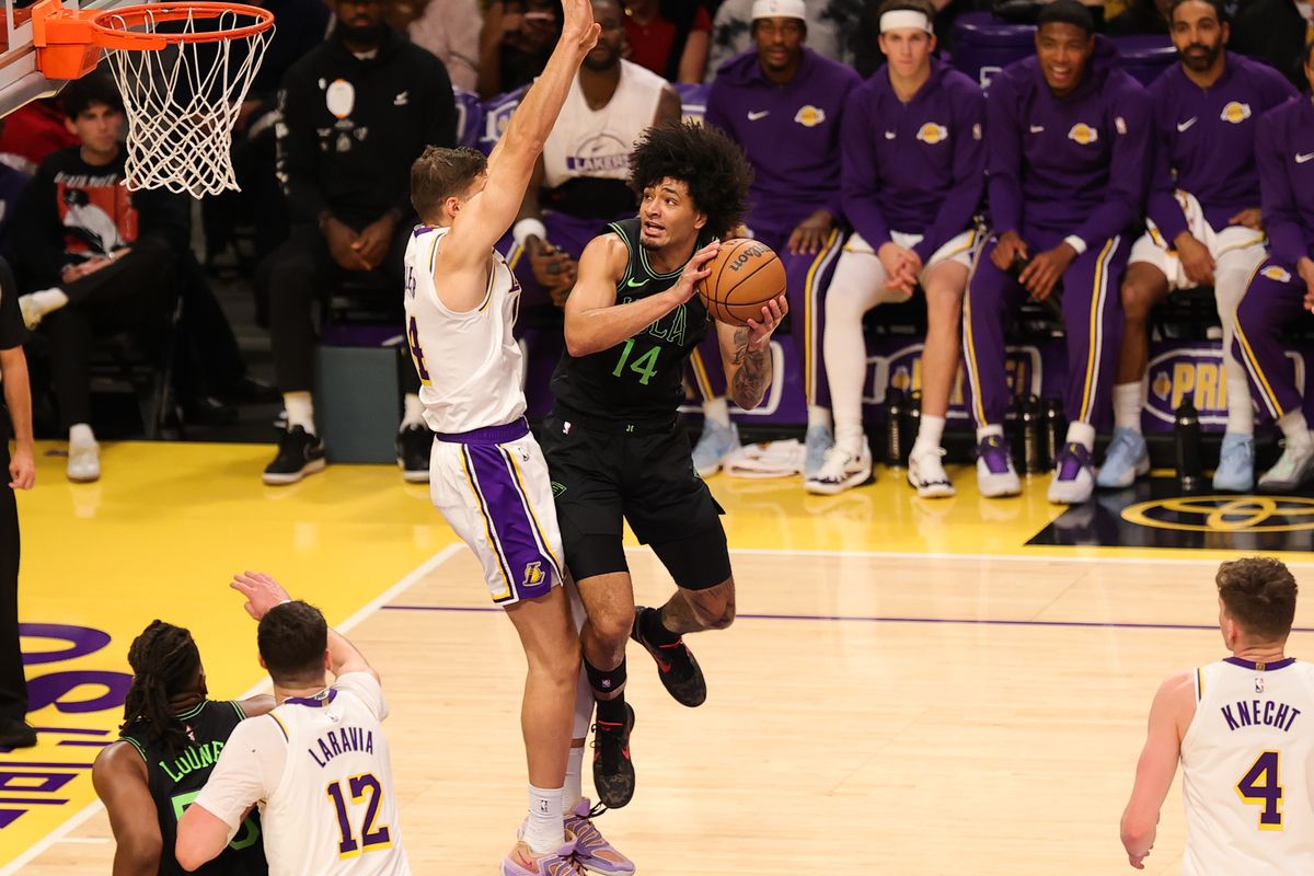 #14 G/F Micah Peavy of the New Orlean Pelicans attempts a lay up during an NBA game against the Los Angeles Lakers on November 30, 2025 in Los Angeles, CA. #14 G/F Micah Peavy of the New Orlean Pelicans attempts a lay up during an NBA game against the Los Angeles Lakers on November 30, 2025 in Los Angeles, CA.