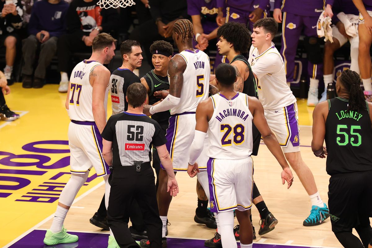 #77 Luka Doncic of the Los Angeles Lakers and #0 G Jeremiah Fears of the New Orleans Pelicans are separated by teammates and officials after a hard foul during an NBA game against on November 30, 2025 in Los Angeles, CA. #77 Luka Doncic of the Los Angeles Lakers and #0 G Jeremiah Fears of the New Orleans Pelicans are separated by teammates and officials after a hard foul during an NBA game against on November 30, 2025 in Los Angeles, CA.