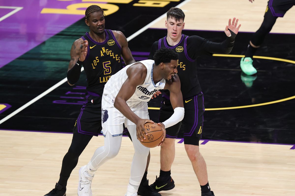 #5 C Deandre Ayton and #12 F Jake LaRavia of the Los Angeles Lakers defend against #8 F/C Jaren Jackson Jr. of the Memphis Grizzlies during an NBA game on January 2, 2026 in Los Angeles, CA. #5 C Deandre Ayton and #12 F Jake LaRavia of the Los Angeles Lakers defend against #8 F/C Jaren Jackson Jr. of the Memphis Grizzlies during an NBA game on January 2, 2026 in Los Angeles, CA.