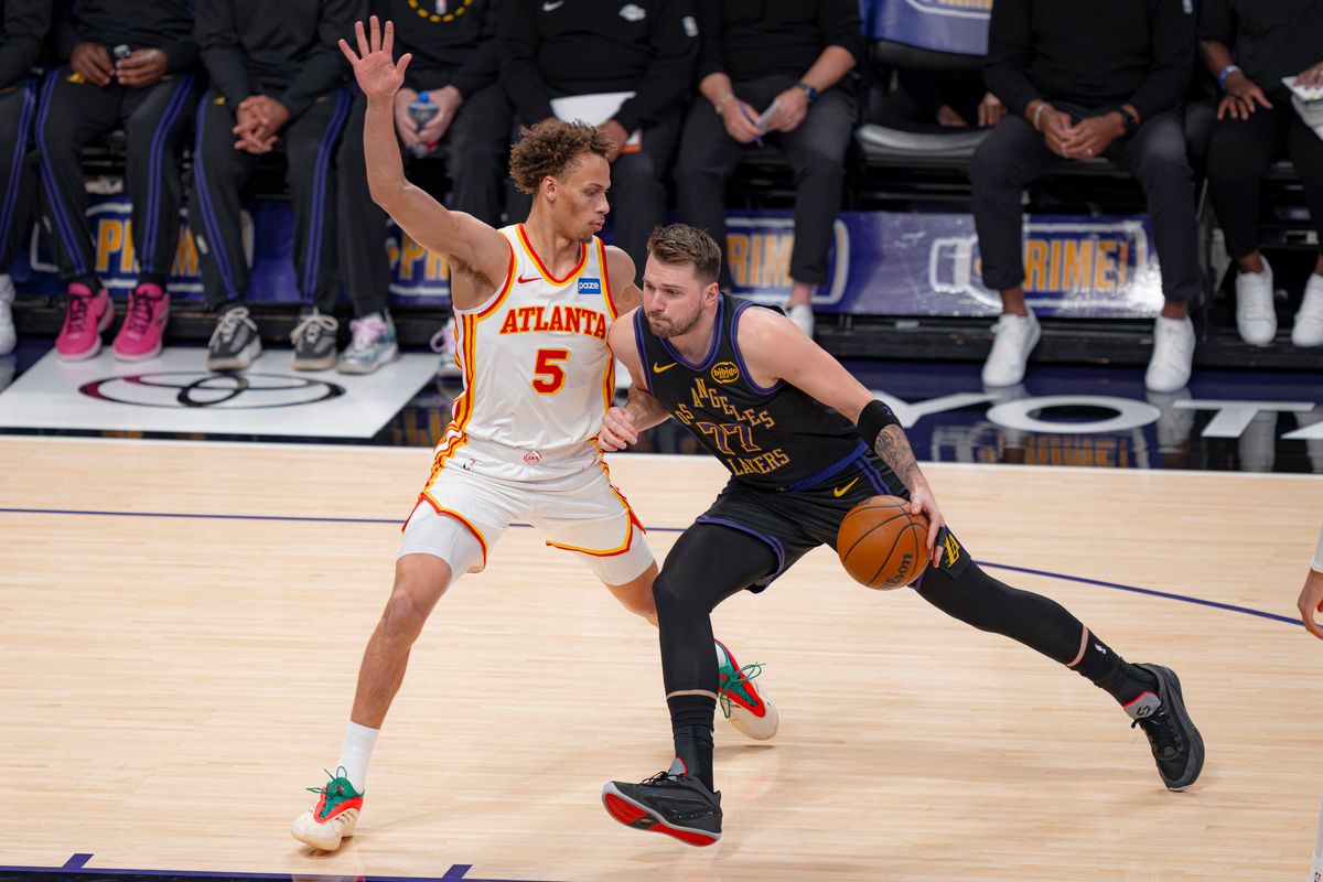 Los Angeles Lakers guard Luka Doncic (77) fighting through a block during an NBA basketball game against the Atlanta Hawks on January 13th, 2026 in Los Angeles, CA.