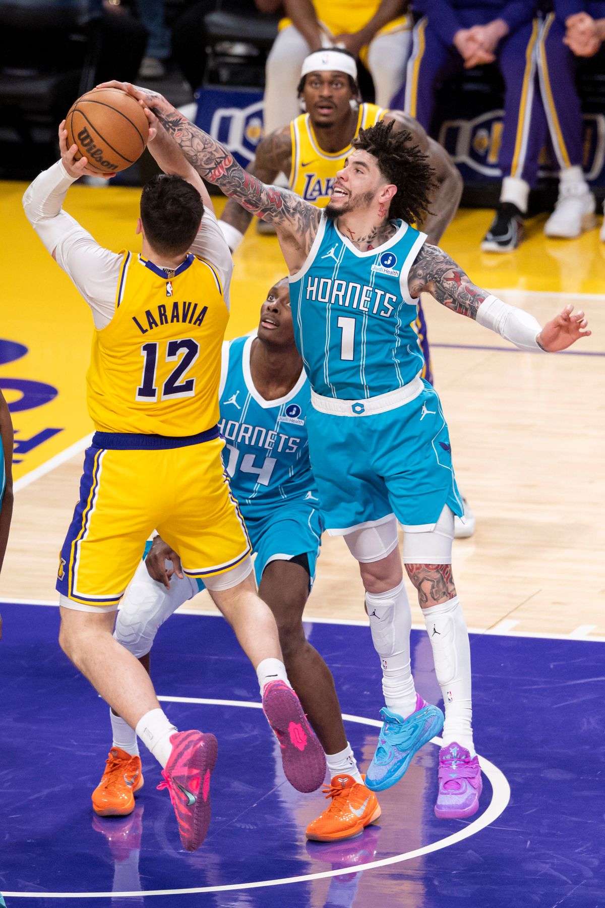 LaMelo Ball #1 of the Charlotte Hornets blocks the shot by Jake LaRavia #12 of the Los Angeles Lakers during an NBA basketball game, Thursday January 15, 2026 in Inglewood, Calif. LaMelo Ball #1 of the Charlotte Hornets blocks the shot by Jake LaRavia #12 of the Los Angeles Lakers during an NBA basketball game, Thursday January 15, 2026 in Inglewood, Calif.