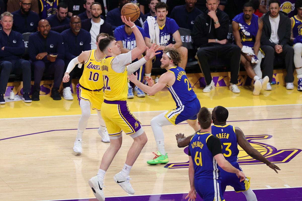 Los Angeles Lakers forward Jake LaRavia (12) shoots the basketball during an NBA game against the Golden State Warriors on February 7, 2025 in Los Angeles, CA. Los Angeles Lakers forward Jake LaRavia (12) shoots the basketball during an NBA game against the Golden State Warriors on February 7, 2025 in Los Angeles, CA.