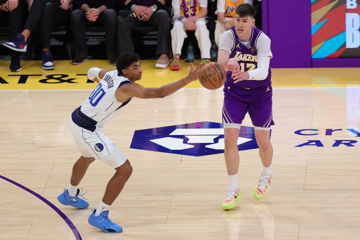 Los Angeles Lakers forward Jake LaRavia (12) passes the basketball during an NBA game against the Dallas Mavericks on February 12, 2026 in Los Angeles, CA. Los Angeles Lakers forward Jake LaRavia (12) passes the basketball during an NBA game against the Dallas Mavericks on February 12, 2026 in Los Angeles, CA.