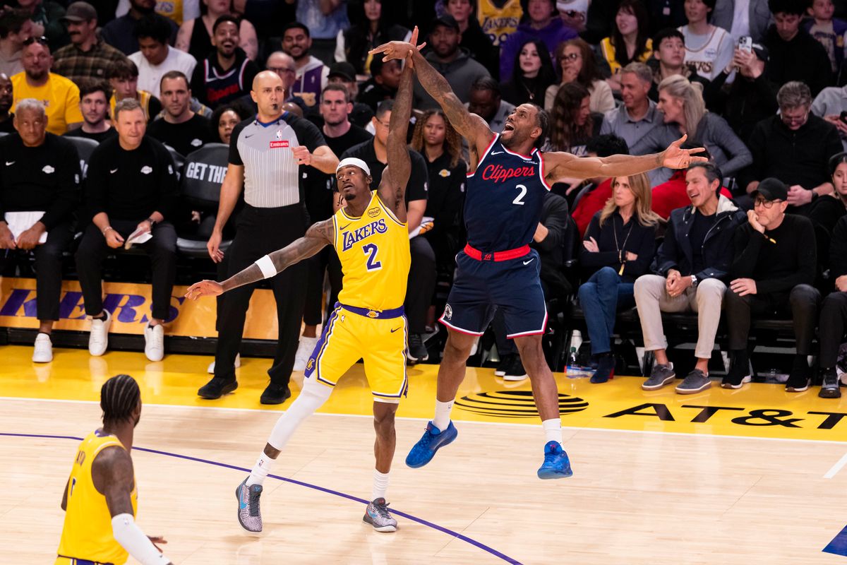 Jarred Vanderbilt #2 of the Los Angeles Lakers fouls Kawhi Leonard #2 of the LA Clippers on a three point attempt during an NBA basketball game, Friday February 20, 2026 in Los Angeles, Calif.