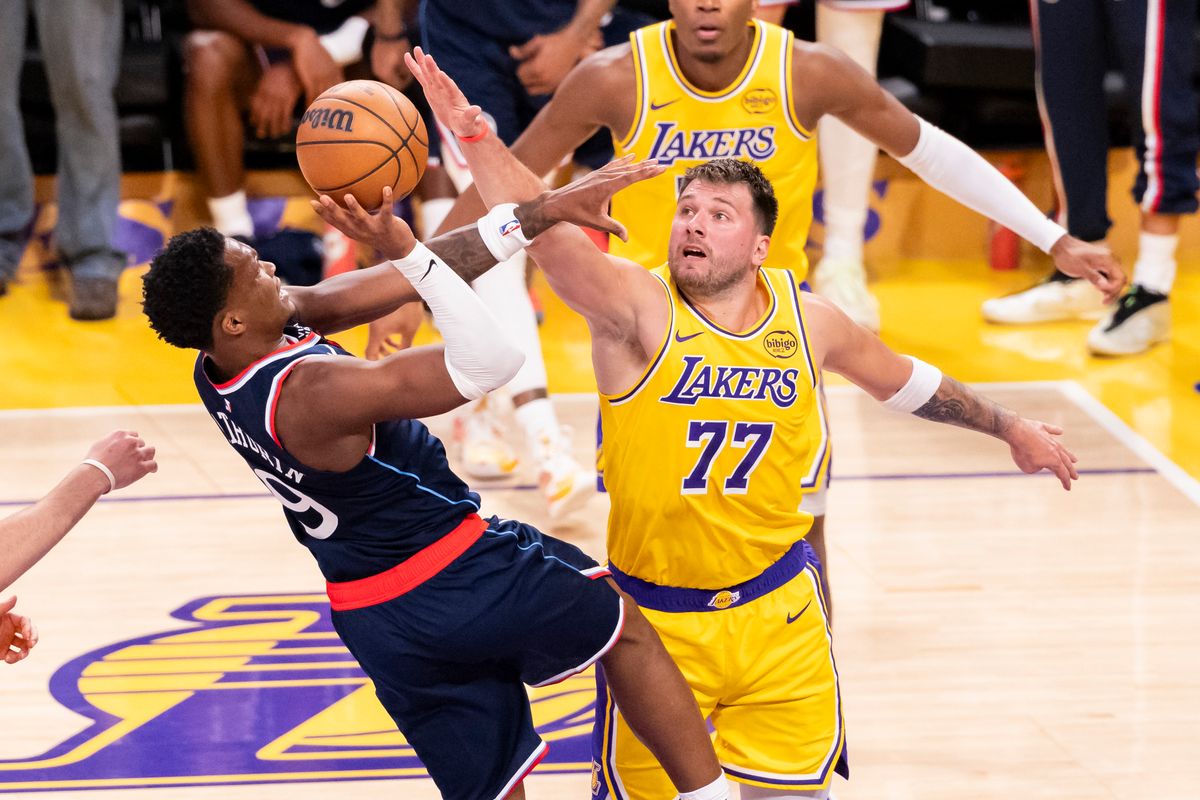 Bennedict Mathurin #9 of the LA Clippers shoots the ball against Luka Doncic #77 of the Los Angeles Lakers during an NBA basketball game, Friday February 20, 2026 in Los Angeles, Calif.