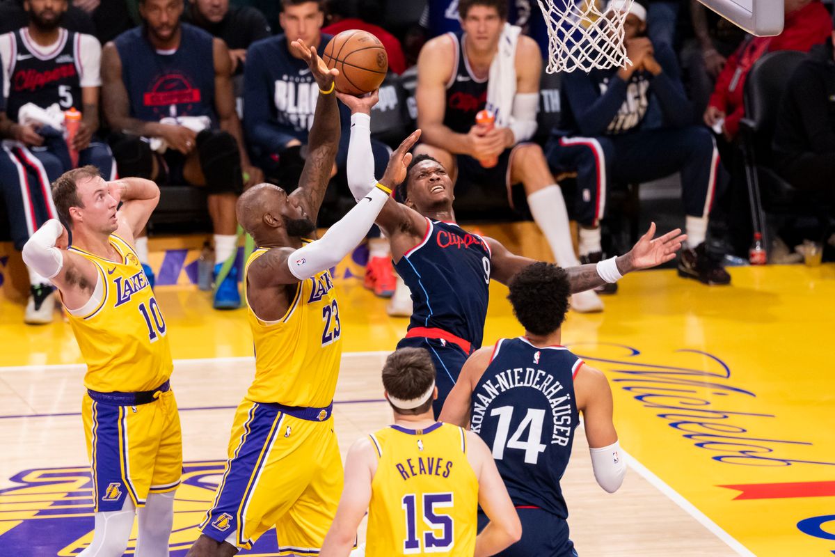 Bennedict Mathurin #9 of the LA Clippers shoots the ball over LeBron James #23 of the Los Angeles Lakers during an NBA basketball game, Friday February 20, 2026 in Los Angeles, Calif.