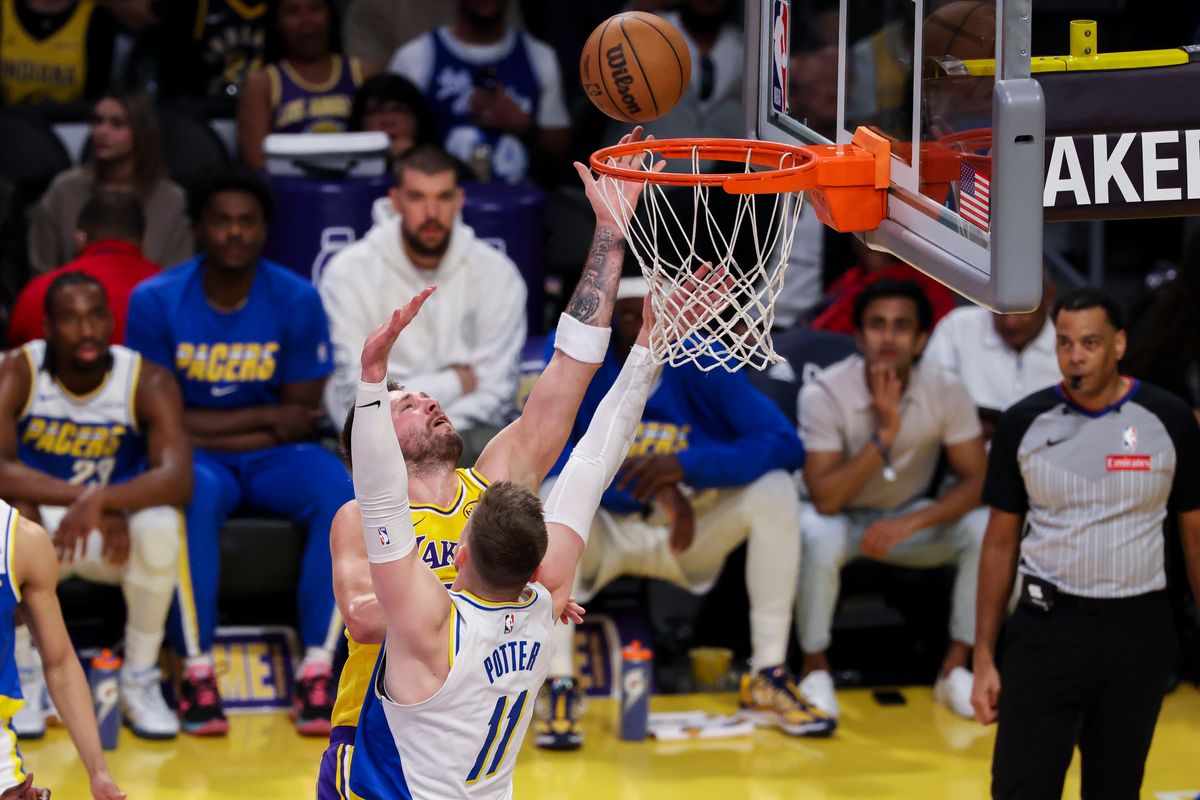 Luka Dončić #77 of the Los Angeles Lakers lays the ball up over Micah Potter #11 of the Indiana Pacers during an NBA basketball game, Friday March 6, 2026 in Los Angeles, Calif. Luka Dončić #77 of the Los Angeles Lakers lays the ball up over Micah Potter #11 of the Indiana Pacers during an NBA basketball game, Friday March 6, 2026 in Los Angeles, Calif.