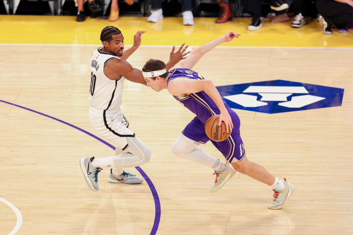 Austin Reaves #15 of the Los Angeles Lakers drives past Ochai Agbaji #30 of the Brooklyn Nets during an NBA basketball game, Friday March 27, 2026 in Los Angeles, Calif. Austin Reaves #15 of the Los Angeles Lakers drives past Ochai Agbaji #30 of the Brooklyn Nets during an NBA basketball game, Friday March 27, 2026 in Los Angeles, Calif.