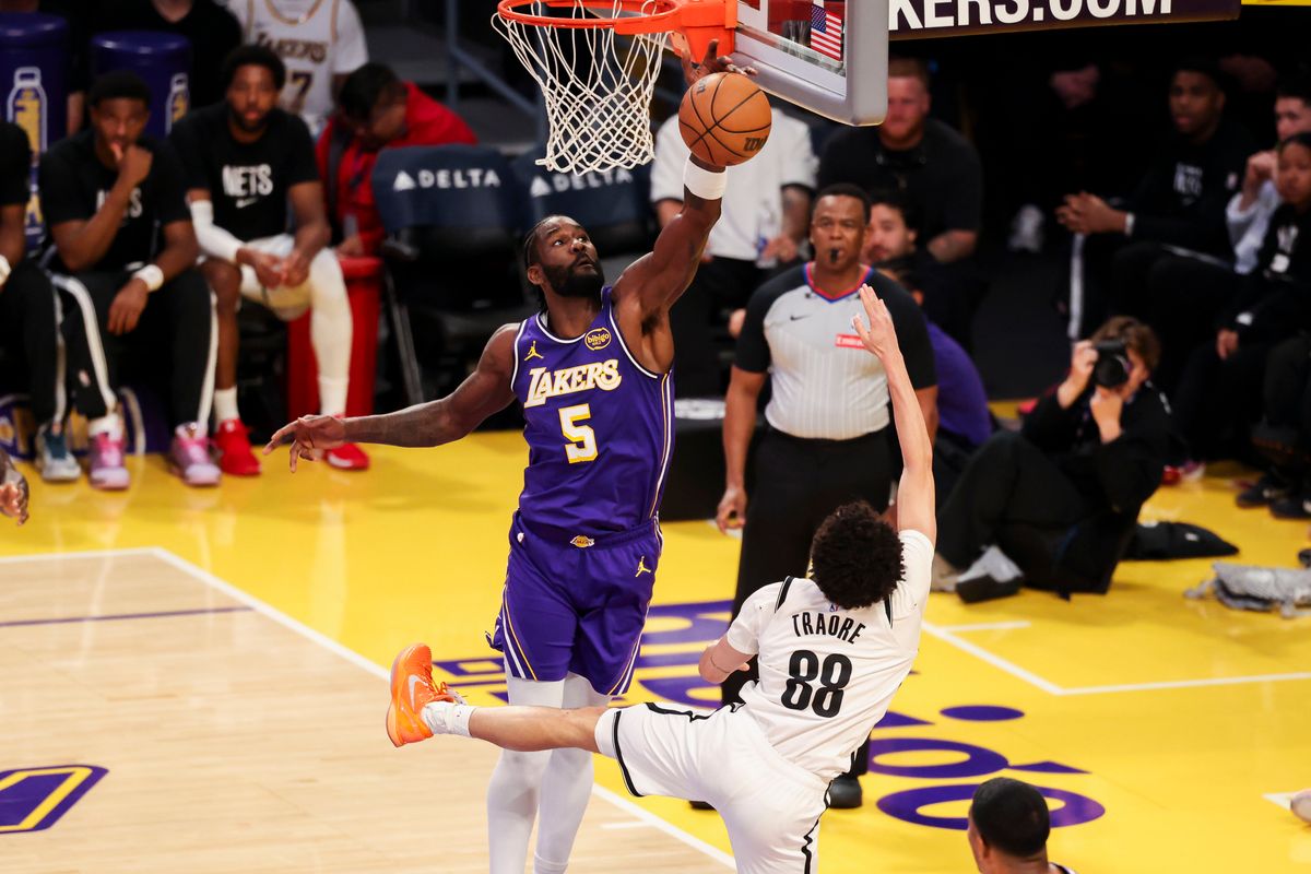 Deandre Ayton #5 of the Los Angeles Lakers blocks the shot by Nolan Traore #88 of the Brooklyn Nets during an NBA basketball game, Friday March 27, 2026 in Los Angeles, Calif. Deandre Ayton #5 of the Los Angeles Lakers blocks the shot by Nolan Traore #88 of the Brooklyn Nets during an NBA basketball game, Friday March 27, 2026 in Los Angeles, Calif.