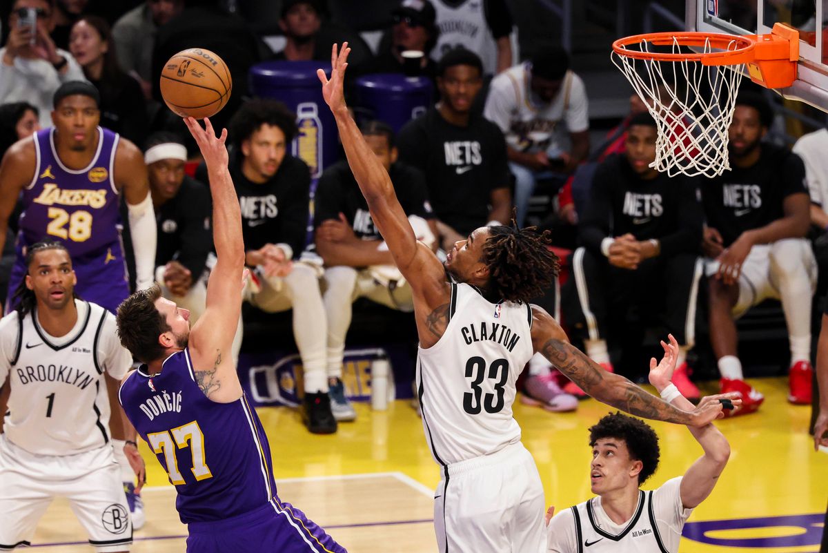 Luka Doncic #77 of the Los Angeles Lakers shoots the ball over Nic Claxton #33 of the Brooklyn Nets during an NBA basketball game, Friday March 27, 2026 in Los Angeles, Calif. Luka Doncic #77 of the Los Angeles Lakers shoots the ball over Nic Claxton #33 of the Brooklyn Nets during an NBA basketball game, Friday March 27, 2026 in Los Angeles, Calif.