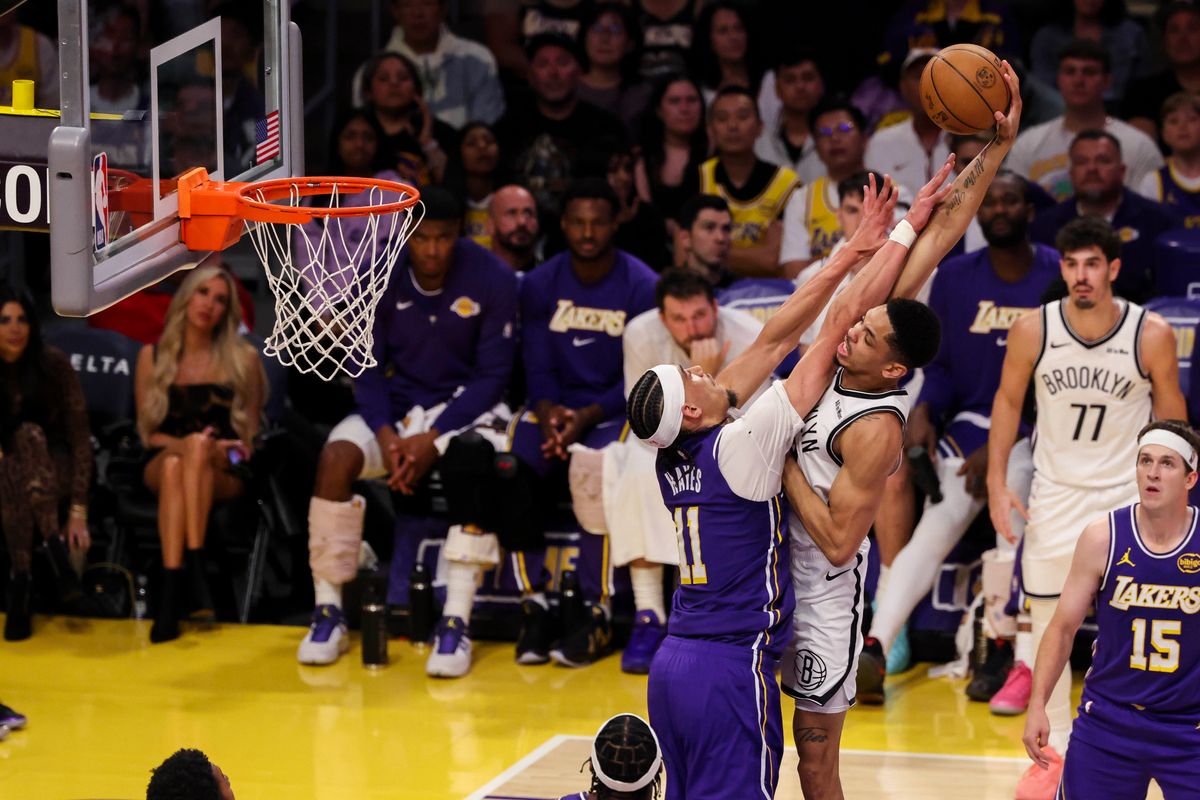 Josh Minott #00 of the Brooklyn Nets reaches way back to attempt a dunk over Jaxson Hayes #11 of the Los Angeles Lakers during an NBA basketball game, Friday March 27, 2026 in Los Angeles, Calif. Josh Minott #00 of the Brooklyn Nets reaches way back to attempt a dunk over Jaxson Hayes #11 of the Los Angeles Lakers during an NBA basketball game, Friday March 27, 2026 in Los Angeles, Calif.