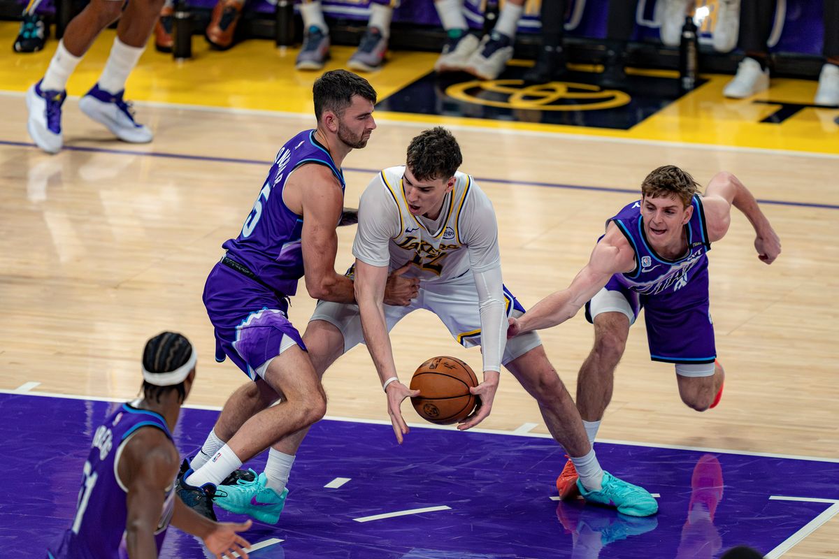 Los Angeles Lakers forward Jake LaRavia (12) maintaining control of the ball during an NBA basketball game against the Utah Jazz on April 12th, 2026 in Los Angeles, CA. Los Angeles Lakers forward Jake LaRavia (12) maintaining control of the ball during an NBA basketball game against the Utah Jazz on April 12th, 2026 in Los Angeles, CA.