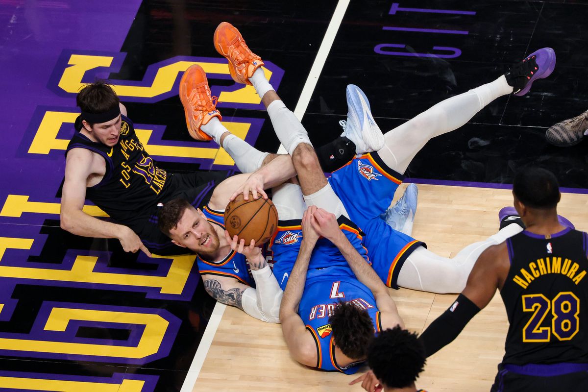 Isaiah Hartenstein #55 of the Oklahoma City Thunder grabs a loose ball as Austin Reaves #15 of the Los Angeles Lakers points to the baseline to signal he is out of bounds during an NBA Playoffs basketball game, Monday May 11, 2026 in Los Angeles, Calif. Isaiah Hartenstein #55 of the Oklahoma City Thunder grabs a loose ball as Austin Reaves #15 of the Los Angeles Lakers points to the baseline to signal he is out of bounds during an NBA Playoffs basketball game, Monday May 11, 2026 in Los Angeles, Calif.