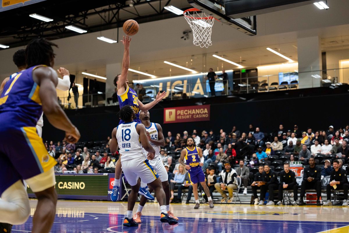 South Bay Lakers guard Chris Mañon (30) puts up a shot during an NBA G League basketball game against the Santa Cruz Warriors on Friday, Nov. 21, 2025, in El Segundo, Calif. South Bay Lakers guard Chris Mañon (30) puts up a shot during an NBA G League basketball game against the Santa Cruz Warriors on Friday, Nov. 21, 2025, in El Segundo, Calif.