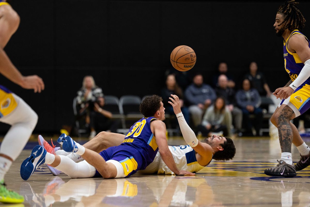 South Bay Lakers guard Chris Mañon (30) battles for a loose ball on the floor during an NBA G League basketball game against the Santa Cruz Warriors on Friday, Nov. 21, 2025, in El Segundo, Calif. South Bay Lakers guard Chris Mañon (30) battles for a loose ball on the floor during an NBA G League basketball game against the Santa Cruz Warriors on Friday, Nov. 21, 2025, in El Segundo, Calif.